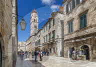 Visitors on Stradun and Franciscan Church and Monastery, Dubrovnik Old Town and Adriatic Sea, Dubrvnik, Dalmatia, Croatia, Europe