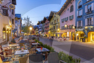 View of architecture and cafes on Vorderstadt at dusk, Kitzbuhel, Austrian Tyrol Region, Austria, Europe