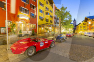 View of architecture and classic car on Vorderstadt at dusk, Kitzbuhel, Austrian Tyrol Region, Austria, Europe