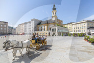 View of St. Michaelskirche and restaurants in Residenzplatz, Salzburg, Austria, Europe
