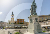 View of St. Michaelskirche and Mozart Statue in Residenzplatz, Salzburg, Austria, Europe