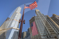 Early morning view of The Wrigley Building and Stars and Stripes US flag on DuSable Bridge, Chicago, Illinois, United States of America, North America
