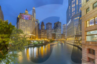 View of Chicago River and buildings illuminated at dusk, Chicago, Illinois, United States of America, North America