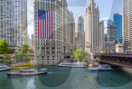 View of American flag on the Wrigley Building and Chicago River, Chicago, Illinios, United States of America, North America