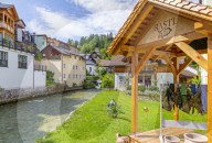 View of colourful buildings and river in Bad Aussie, Styria, Austria. Europe