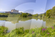 View of Trautenfels Castle reflection in Schlossteich FischstÃ¼berl fishing pond, Styria, Austria. Europe