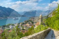View of cruise ship and Chapel of Our Lady of Salvation overlooking the Old Town, UNESCO World Heritage Site, Kotor, Montenegro, Europe