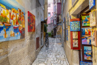 View of fine art and colourful paintings on cobbled street in the old town, Rovinj, Istria, Croatia, Adriatic, Europe
