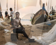 Fishermen fixing nets, Cape Coast, Ghana, Africa