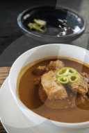Bowl of traditional Ghanaian dish of fish soup and homemade Fufu, Busua, Ghana, Africa