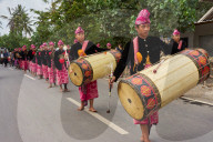 Drummers leading a traditional Sasak wedding procession.