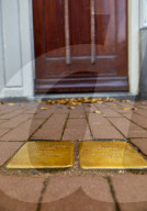 Stumbling Stones or Stolpersteine, Holocaust memorial placed in front of victims last home, Nieuwe Uilenburgerstraat, Amsterdam.