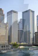 Downtown skyline and river cruise boat on the Chicago River near the Michigan Avenue Bridge.