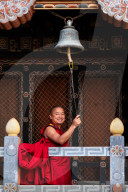 Buddhist monk ringing prayer bell, Trongsa Dzong, Trongsa, Bhutan.