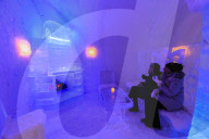 Sorrisniva Igloo Hotel, ice hotel, striking sculpture, cosy fire in ice bar, Alta, Winter snow, Finnmark, Arctic Circle, Norway