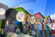 Long Bay Beach, colourful tourist souvenir stall and beach huts, blue sky, Antigua, Leeward Islands, West Indies, Caribbean