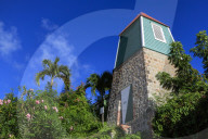 Swedish Bell Tower, palm trees and flowering shrubs, Gustavia, St. Barthelemy (St. Barts, St Barth), West Indies, Caribbean