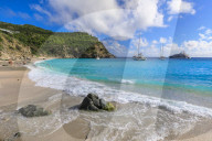 Shell Beach, yachts anchored in turquoise bay, people in sea, Gustavia, St. Barthelemy (St. Barts, St Barth), Caribbean