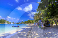 Saltwhistle Bay, white sand beach, turquoise sea, colourful boat, yachts, palm trees, Mayreau, Grenadines, St Vincent, Caribbean