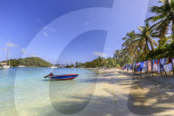 Saltwhistle Bay, white sand beach, turquoise sea, colourful boat, yachts, palm trees, Mayreau, Grenadines, St Vincent, Caribbean