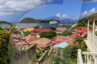 View to beautiful Les Saintes Bay across red roofs of town, Terre de Haut, Iles Des Saintes, Guadeloupe, West Indies, Caribbean