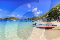 Saltwhistle Bay, white sand beach, turquoise sea, colourful boat, yachts, palm trees, Mayreau, Grenadines, St Vincent, Caribbean