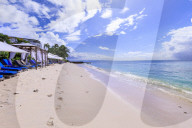 Paynes Bay, luxury sun loungers and cabanas on fine pale pink sand beach, beautiful West Coast, Barbados, Caribbean