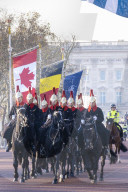Guardsmen of the Blues and Royals regiment of the Queen's Life Guards riding along the Mall in front of Buckingham Palace