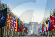 View of the Buckingham Palace and the Mall lined with flags