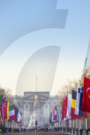 View of the Buckingham Palace and the Mall lined with flags