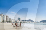 Brazil, Rio de Janeiro, Copacabana beach. Locals playing frescobol (aka Matkot) in the morning