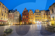 Illuminated historic buildings at dusk, Stortorget Square, Gamla Stan, Stockholm, Sweden
