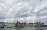 Storm clouds over the historic buildings of Gamla Stan by the sea, Stockholm, Sweden