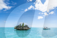 Tourists on boat trip admiring Crystal Rock in the lagoon, La Gaulette, Le Morne Brabant, Black River, Indian Ocean, Mauritius