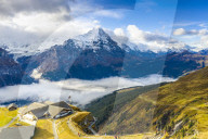 Hikers admiring the autumn landscape from elevated walkway (Cliff Walk by Tissot), First, Grindelwald, Canton Bern, Switzerland