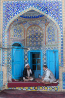 Men discussing in a corner of the Blue Mosque, Mazar-E-Sharif, Afghanistan