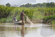 Fishermen in their canoe, Niger river, Niamey, Niger