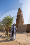 Imam before the Grand mosque of the Unesco world heritage sight Agadez, Niger
