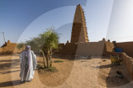 Imam before the Grand mosque of the Unesco world heritage sight Agadez, Niger