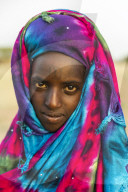 Colourful dressed girl at the Gerewol festival, courtship ritual competition among the Woodaabe Fula people, Niger