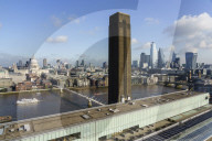 City of London skyline with Tate Modern art gallery in the foreground, London, England
