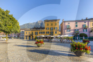Colourful square of the village of Colico in the summer. Como Lake, Lombardy, Italy, Europe.