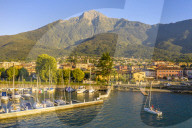Sailing boat arrived at the port of Colico village. Como Lake, Lombardy, Italy, Europe.