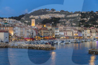 View from the port to the old town at dusk, Cassis, France, Europe