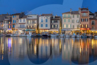 View from the port to the old town at dusk, Cassis, France, Europe
