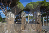 surroundings of the tether, three theatrical masks, , Ostia antica, Roma, Lazio, Italy.