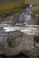 Waterfall cascading in to the River Etive, Glen Etive, Argyll and Bute, Scotland, United Kingdom, Europe