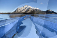 Ice formations with Mount Michener in the background at sunrise, Abraham Lake, Alberta, Canada, North America