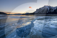 Ice formations with Mount Michener and Kista Peak in the background at sunrise, Abraham Lake, Alberta, Canada, North America