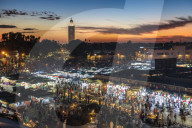 View over the Djemaa el Fna at dusk showing food stalls and crowds of people, Marrakech, Morocco, North Africa, Africa